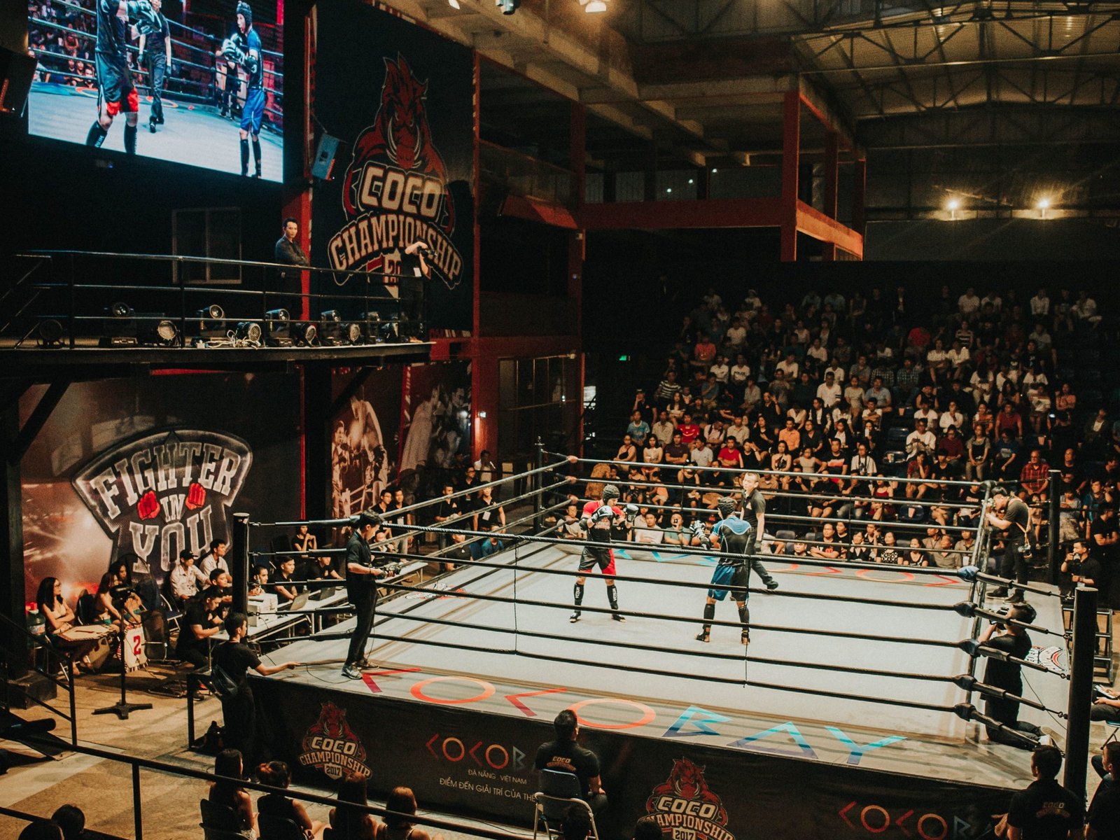 boxing-match-spectators-surround-the-boxing-ring