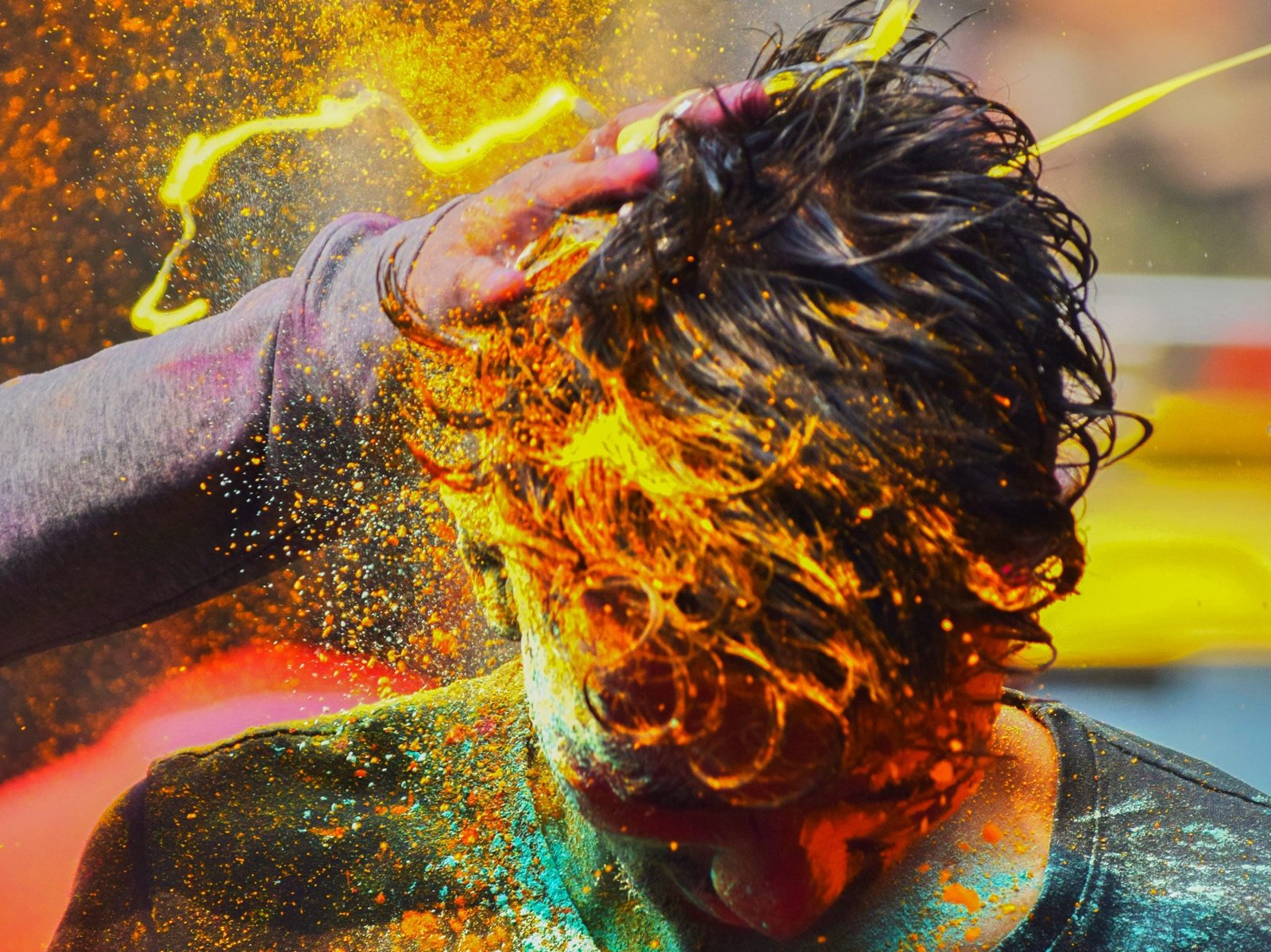 colorful-powder-poured-onto-head