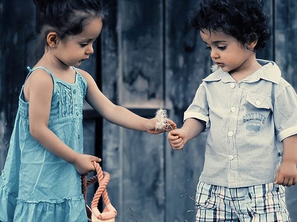 little brother and sister playing